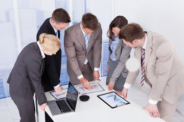 Business People Working At Conference Table