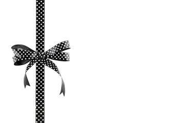 Black and white ribbon with a bow on a white background