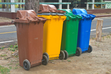 Different colorful recycle bins