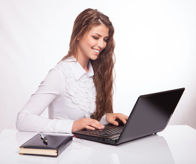Business woman working online on a laptop