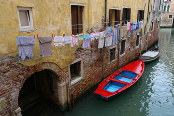 Boats moored in a canal in Venice
