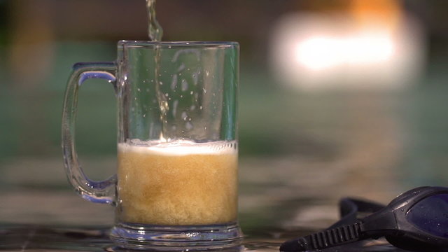 Beer pour to the glass, steadycam shot, slow motion shot
