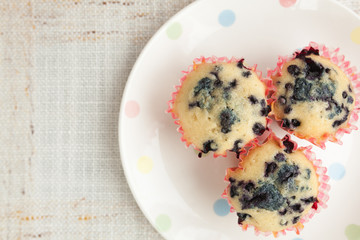 Homemade blueberry muffins in paper cupcake holder
