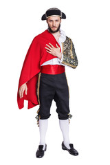 Man in a matador costume with a red cape