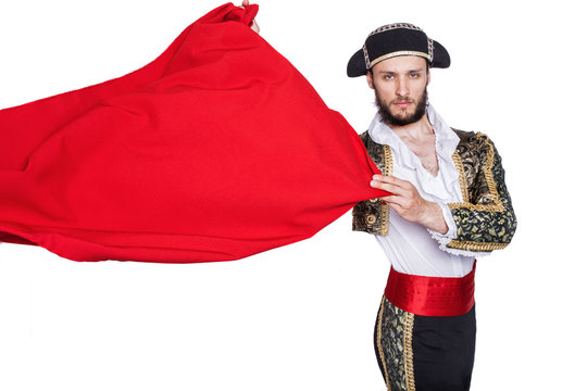 Matador throwing a red cape