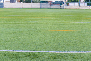 Fototapeta na wymiar football amateur stadium with green grass