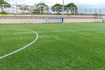 Fototapeta na wymiar football amateur stadium with green grass
