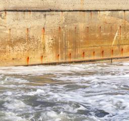 Seawater and the old concrete wall