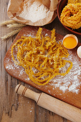Still life with raw homemade pasta and ingredients for pasta