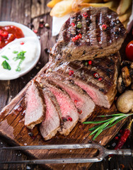Beef steak on wooden table