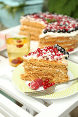 Tasty cake with fresh berries on table, close up