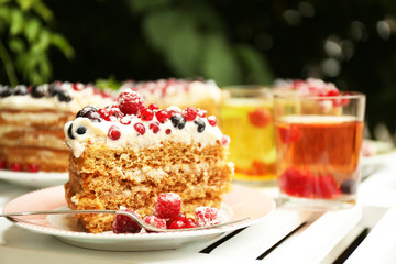 Tasty cake with fresh berries on table, close up