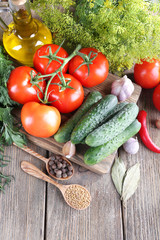Fresh vegetables with herbs and spices on table, close-up