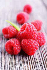 Ripe sweet raspberries on table close-up