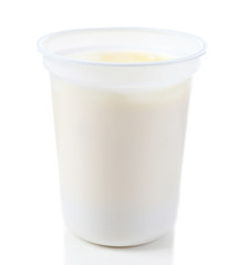 Glass of yogurt isolated on white