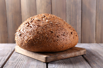 Fresh bread on wooden table, close up