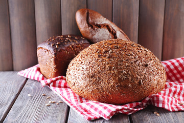 Fresh bread on wooden table, close up