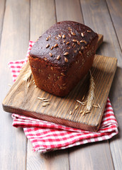 Fresh bread on wooden table, close up