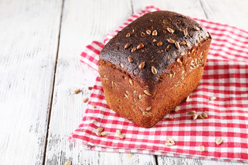 Fresh bread on wooden table, close up
