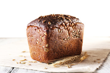 Fresh bread on wooden table, close up