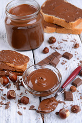 Sweet chocolate cream in bowl on table close-up