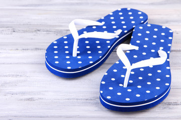 Color flip-flops on wooden background