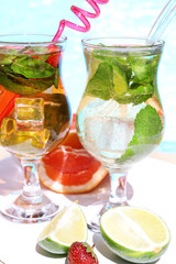 Delicious cocktails on beach, close-up
