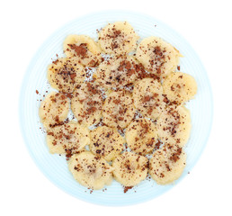 Sweetened fried banana on plate, isolated on white