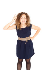 Beautiful Hispanic woman doing different expressions in different sets of clothes: at attention