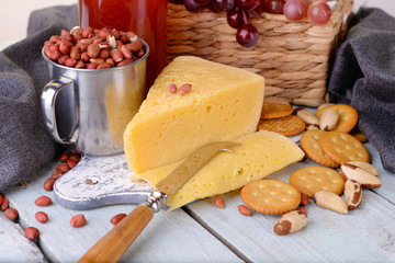 Cheese and crackers on wooden table close-up