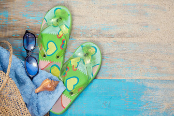 Bag, towel, sun glasses, shell and flip flops