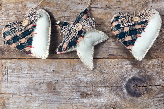 fabric country hearts and star hanging on wooden