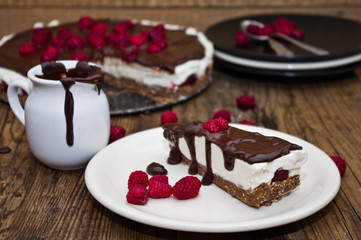 Unbaked cheesecake with chocolate and raspberries