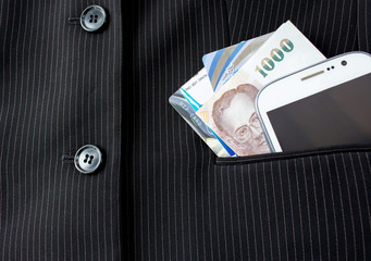 Modern mobile phone with one thousand baht Thailand and credit c