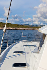 Fototapeta na wymiar The white yacht floats by the blue sea in Croatia