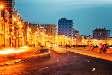 Fototapeta na wymiar Sunset in Old Havana with the street lights of El Malecon
