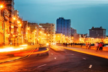 Foto op Plexiglas Sunset in Old Havana with  the street lights of El Malecon © kmiragaya