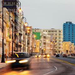 Sunset in Old Havana with  the street lights of El Malecon