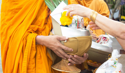 Giving alms to monks receive alms