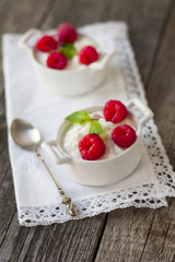 dessert from cottage cheese and raspberries  on wooden backgroun