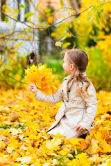 Little girl outdoors on autumn day