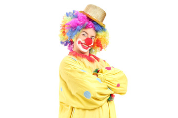 Funny male clown in a yellow costume