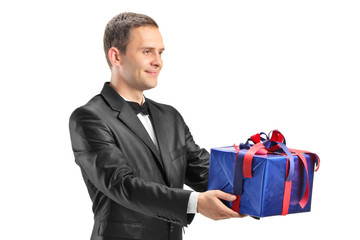 Guy holding a present