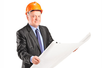 Mature architect looking at a construction plan