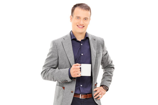 Elegant Man Holding A Coffee Mug