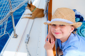 Little girl at luxury yacht with pet dog