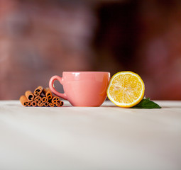 Cup of tea with lemon on table close-up
