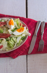 salad with tomatoes, egg, cucumbers