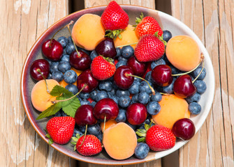 Bowl of summer  fruits and berries.