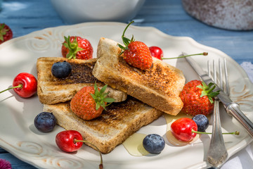 Toast with fruit and honey for breakfast